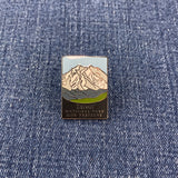 Pin with denali national park mountain design on a denim background