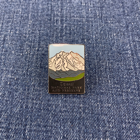 Pin with denali national park mountain design on a denim background
