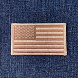 Tan and brown American flag patch on a denim background