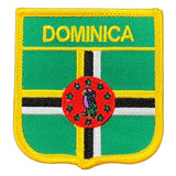 A shield-shaped embroidered patch with the name 'DOMINICA' at the top. 