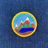 Embroidered patch of Donner Lake on a denim background