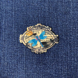 Decorative patch with a blue dragonfly on denim fabric