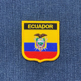 Ecuador patch with national colors on a denim background