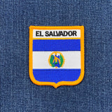 El Salvador flag patch on a blue denim background