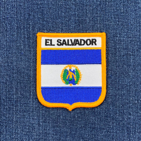 El Salvador flag patch on a blue denim background