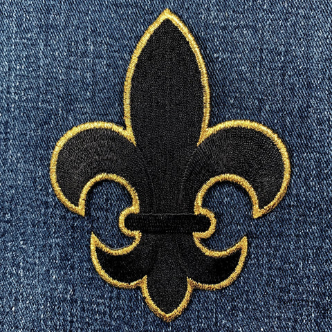 extra large black and gold fleur-de-lis patch on denim fabric