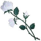 Detailed extra large embroidered patch depicting a white rose stem with two open white blossoms and one closed white bud. The flowers have a shimmering or iridescent quality, and the leaves and stems are dark green.