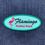Embroidered patch with 'Flamingo Trailer Park' design on a denim background