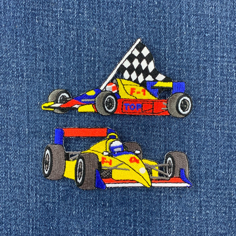 two patches of formula 1 race cars on a denim background