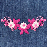 Floral embroidery patch on denim fabric
