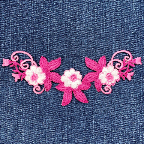 Floral embroidery patch on denim fabric