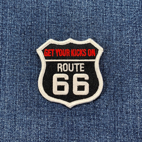 Patch with 'Get Your Kicks On Route 66' text on denim fabric