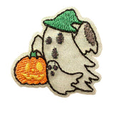 Embroidered patch of a ghost holding a pumpkin with a green hat on a white background
