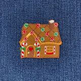 Gingerbread house patch on a denim background