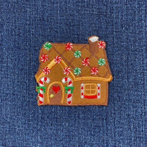 Gingerbread house patch on a denim background