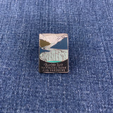 Pin with glacier bay national park mountain design on a denim background