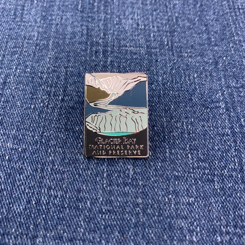 Pin with glacier bay national park mountain design on a denim background