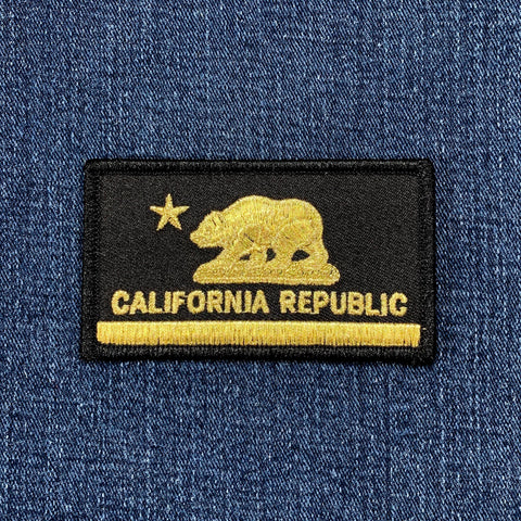 Black and gold California Republic patch with bear and star design on blue denim fabric