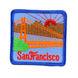 An embroidered square patch featuring the Golden Gate Bridge in San Francisco, with a blue border and the word 'San Francisco' in red script at the bottom, shown on a plain white background.