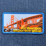 Embroidered patch of the San Francisco Golden Gate Bridge on denim fabric.