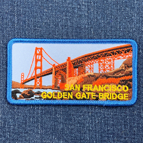 Embroidered patch of the San Francisco Golden Gate Bridge on denim fabric.