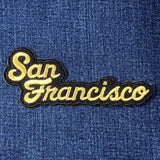Embroidered patch with 'San Francisco' text on a denim background
