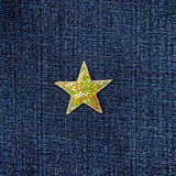 Star-shaped gold sequin patch on a denim background