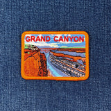 Embroidered patch depicting the Grand Canyon landscape with the text 'GRAND CANYON' on top.
