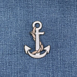 Embroidered anchor patch on denim fabric