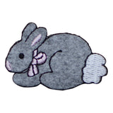 Embroidered patch of a gray bunny with a pink bow on a white background