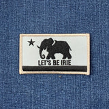 Patch with an elephant design and 'Let's Be Irie' text on denim fabric