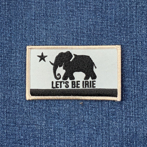Patch with an elephant design and 'Let's Be Irie' text on denim fabric