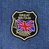 Embroidered patch with 'Great Britain' text and Union Jack on blue denim background