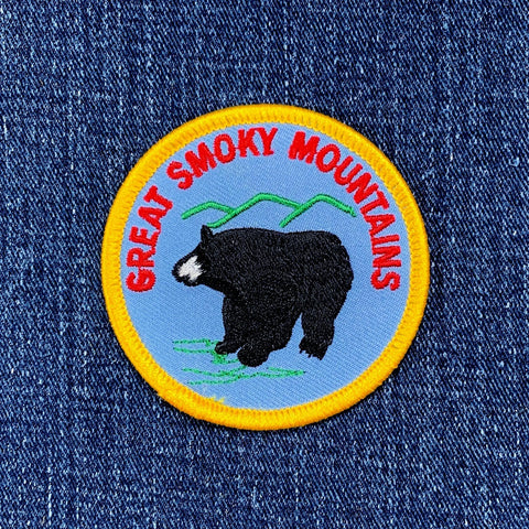 Embroidered patch of the Great Smoky Mountains with a bear on blue fabric.