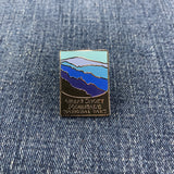 Pin with great smoky mountain design on a denim background