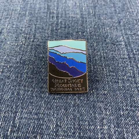 Pin with great smoky mountain design on a denim background