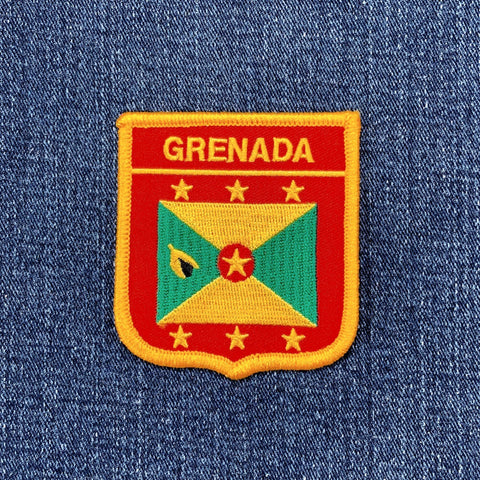 Grenada flag shield patch on a denim background