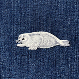 Embroidered seal patch on denim fabric