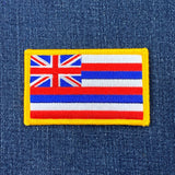 Hawaii state flag patch on a denim background