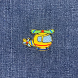 Colorful helicopter patch on denim fabric