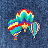 Colorful hot air balloon patch on denim fabric