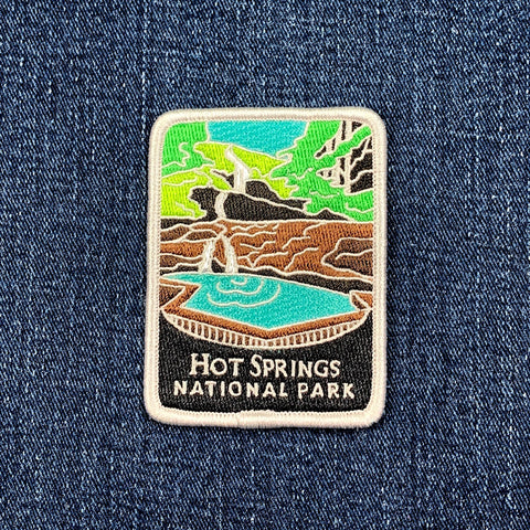 Embroidered patch of Hot Springs National Park on a denim background