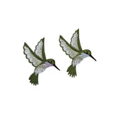 Two embroidered hummingbird patches on a white background