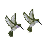 Two embroidered hummingbird patches on a white background