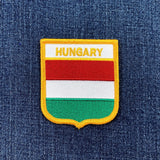 Embroidered patch of the Hungarian flag on a denim background