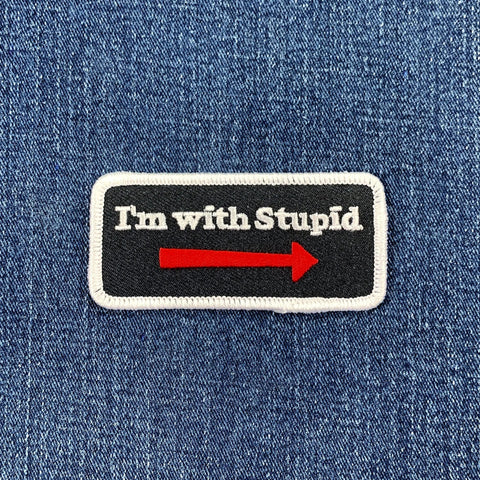 Patch with 'I'm with Stupid' text on a denim background