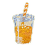 An embroidered patch shaped like a clear plastic cup filled with orange-yellow iced coffee, with a striped straw, shown on a white background.