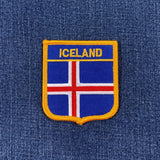 Icelandic flag patch on a blue denim background