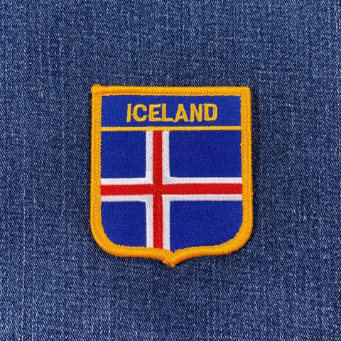 Icelandic flag patch on a blue denim background