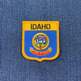 Idaho state patch on a blue denim background